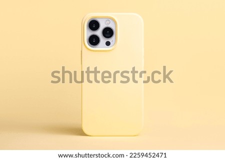 yellow banana color phone case mockup. iPhone 13 and 14 Pro Max mock up back view isolated on yellow background