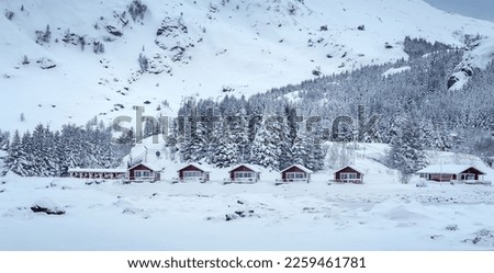 Amazing winter nature scenery of Norway. Beautiful winter mountain landscape with traditional mountain huts in the forest on highland. Wintry wonderland wallpaper. Winter vacations. chrismas concept.