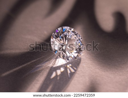 Close up of a pare of blue and white diamonds of different cuts with shadows. Royalty-Free Stock Photo #2259472359