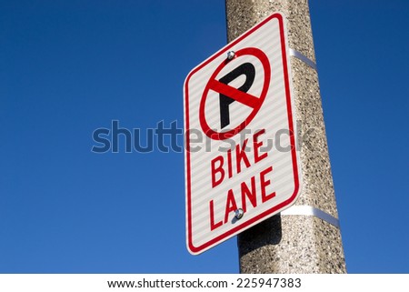 The "No Parking Bike Lane" sign.