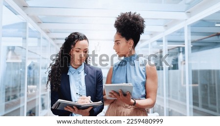 Mentor, discussion and business women walking in office workplace. Leadership, coaching and group of people or employees in hallway talking, planning or brainstorming project with tablet and books. Royalty-Free Stock Photo #2259480999
