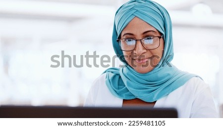 Muslim business woman, face and working at laptop, email and communication with focus and technology. Worker in hijab, corporate goals with internet, networking and research online for project