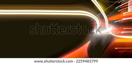 Abstract colorful background with red, white and yellow glowing lines of different thickness and curvature from city lights on a black background. The blur is intentional.	
