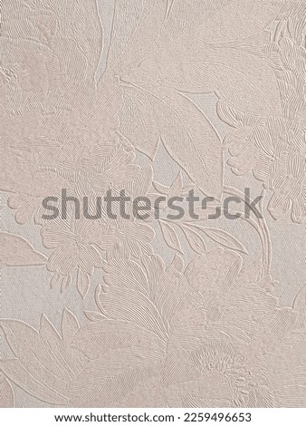 Baby pink colored wallpaper has the texture and patterns of flowers and other florals