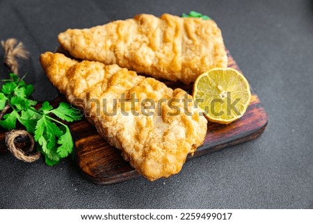 cod fried fish in batter delicious seafood healthy meal food snack on the table copy space food background rustic top view  pescatarian diet Royalty-Free Stock Photo #2259499017