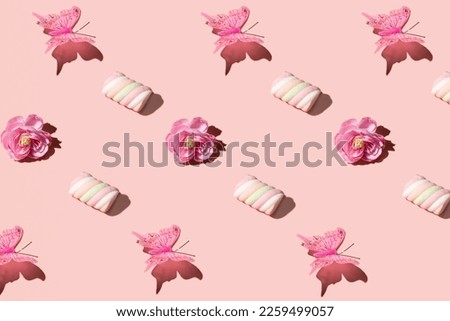 Cute decorative elements, creative pattern, pastel pink background. Spring nature inspired layout. 