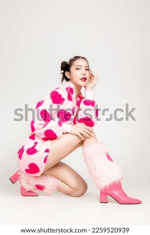 Full length Young Pretty Asian woman have prefect slim fit body in heart print dress with makeup on face sitting isolated on white background. Valentine, love, plastic surgery concept. Royalty-Free Stock Photo #2259520939