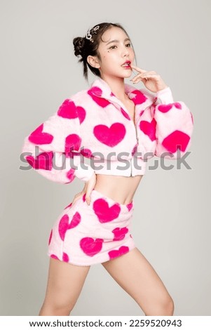 Young Pretty Asian woman have prefect slim fit body in heart print dress with makeup on face isolated on white background. Valentine, love, plastic surgery concept. Royalty-Free Stock Photo #2259520943