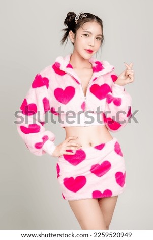 Young Pretty Asian woman have prefect slim fit body in heart print dress with makeup on face isolated on white background. Valentine, love, plastic surgery concept. Royalty-Free Stock Photo #2259520949