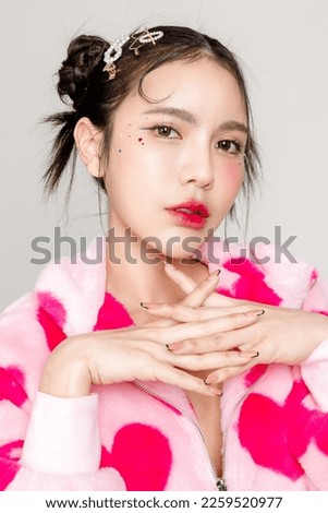 Young Pretty Asian woman have prefect slim fit body in heart print dress with makeup on face isolated on white background. Valentine, love, plastic surgery concept. Royalty-Free Stock Photo #2259520977