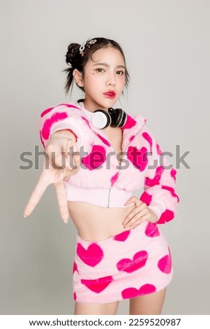 Young Pretty Asian woman have prefect slim fit body in heart print dress and headphone with makeup on face isolated on white background. Valentine, love, plastic surgery concept. Royalty-Free Stock Photo #2259520987