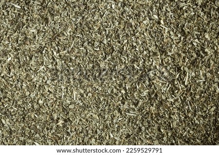Close-up of dry oregano, an aromatic herb usual in Mediterranean cuisine. Organic texture abstract background.  Royalty-Free Stock Photo #2259529791