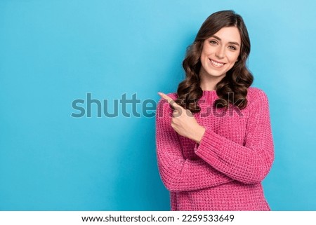 Photo of adorable pretty glad lady wear pink clothes arm direct empty space opening new boutique isolated on blue color background