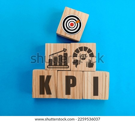 View of wooden square with a KPI or Key Performance Indicator icon. business goals, performance results, and indicators Royalty-Free Stock Photo #2259536037