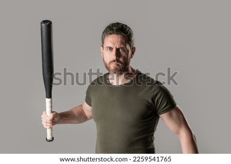 photo of angry aggressive man hold bat. angry man threatening. angry man express anger
