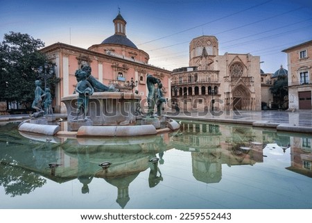 Fountain of the Placa de la Verge square with amazing architecture in Valencia at dawn, Spain Royalty-Free Stock Photo #2259552443