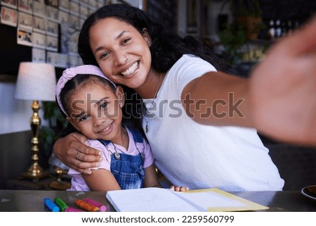 Mother portrait, girl child and selfie in cafe with book for drawing, learning art and color. Education, family and mama hug kid or daughter and taking pictures for social media or happy memory.