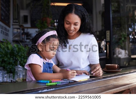 Art, drawing and mother and child at a restaurant with an activity, creativity and color on paper. Creative, happy and girl learning to draw with her mom while eating at a cafe and waiting for food