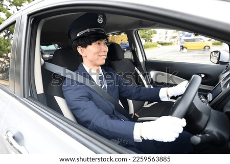 Male driver driving a taxi Royalty-Free Stock Photo #2259563885