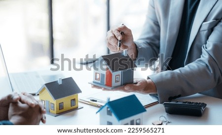 Real estate agent offer to sell house and land to their client. Offer a sample house, make a contract to reserve a house recommend credit and home fire insurance for customer.