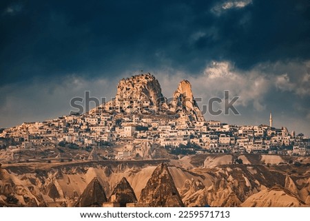 Explore the historic Uchisar Castle Town and the breathtaking Goreme Valley in Cappadocia, Turkey. Royalty-Free Stock Photo #2259571713