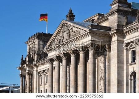Reichstag Building. Facade Deutscher Bundestag with many beautiful sculptures. The dedication Dem deutschen Volke, meaning To the German people, on the frieze. Royalty-Free Stock Photo #2259575361