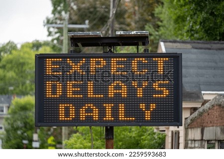 Construction sign warning of delays ahead