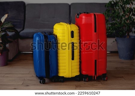 colorful packed suitcases with belongings . Travel concept