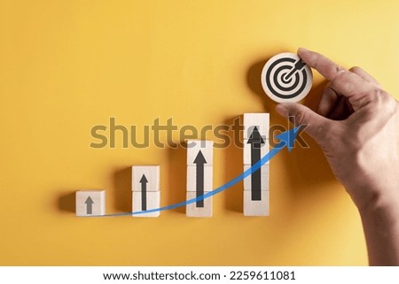 Stock market and exchange chart concept.  wooden block stack business chart or graph with arrows icon. Stock market and economy growth of investment.