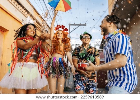 Brazilian Carnival. Group of friends celebrating carnival party Royalty-Free Stock Photo #2259613589