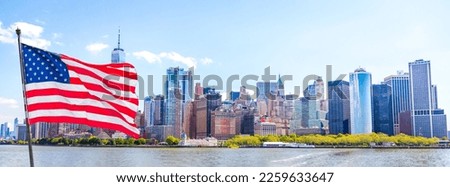 Skyline panorama of downtown Financial District and the Lower Manhattan in New York City with american flag, USA