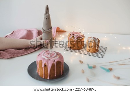 Easter cake, colorful eggs and rabbit toy. Happy Easter holiday concept. festive spring season