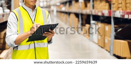 Portrait asian engineer man shipping order detail check goods and supplies on shelves with goods background inventory in factory warehouse.logistic industry and business export
