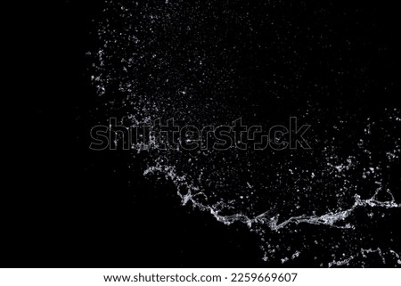 Shape form droplet of Water splashes into drop water attack fluttering in air and stop motion freeze shot. Splash Water for texture graphic resource elements, black background isolated Royalty-Free Stock Photo #2259669607