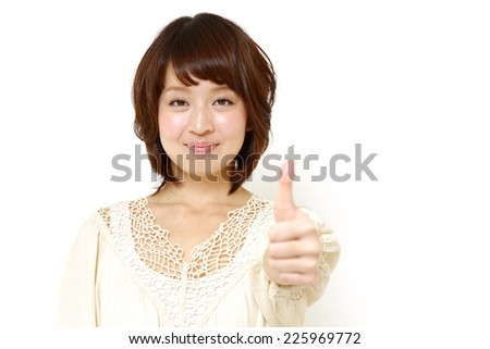 woman with thumbs up gesture