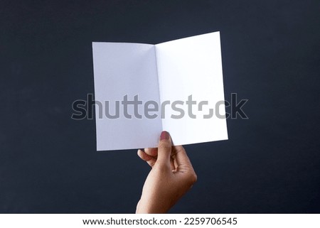 Hand opening A6 blank white brochure booklet mockup. Booklet design template. 