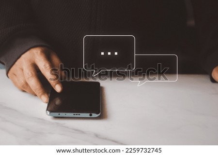 Woman using smartphone typing Live chat chatting and social network concepts, chatting conversation in chat box icons pop up. Social media marketing technology concept.