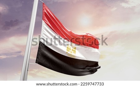 Egypt national flag waving in the sky.