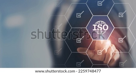 ISO standards quality control, assurance and warranty business technology concept. Touching on screen with ISO and globe icons on smart background. ISO Standard certification. Modern ISO banner. Royalty-Free Stock Photo #2259748477