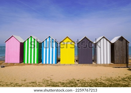 Colored beach huts La Bree-les-Bains  city on beach oleron french isle Royalty-Free Stock Photo #2259767213
