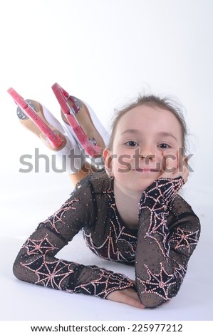 Little ice skater girl in skate suit