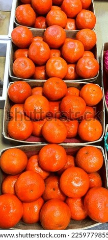 bright orange stacked in basket on a market 