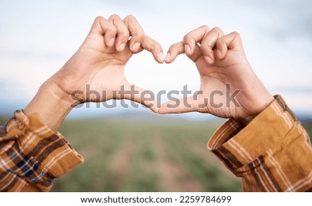 Heart hands, agriculture and farming and countryside for sustainability, farming or agro business people in industry. Love emoji sign, farmer couple and plants growth on field sustainable development