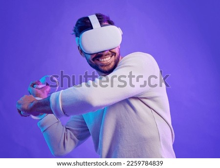 Man fight in metaverse, virtual reality glasses and futuristic game for vr gaming in cyber 3d world. Gamer person with hand controller for ar, digital experience and cyberpunk purple background app