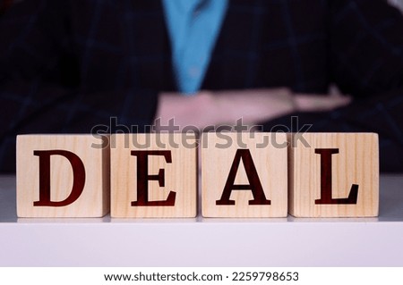 The word "DEAL" written on wood cube. Business concept