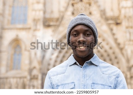 Happy African man on vacation in the city.