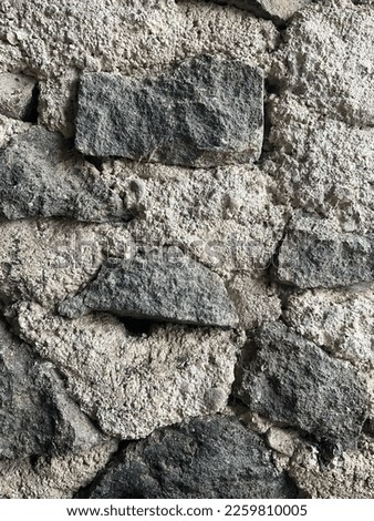 Wall made of stone and cement