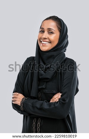 Beautiful middle eastern woman wearing abaya posing in studio for hijab fashion portraits