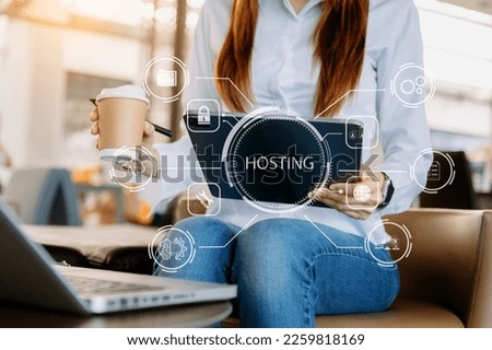Web hosting concept, woman using computer laptop, tablet and presses his finger on the virtual screen inscription Hosting on desk, Internet, business, digital technology concept.

 Royalty-Free Stock Photo #2259818169