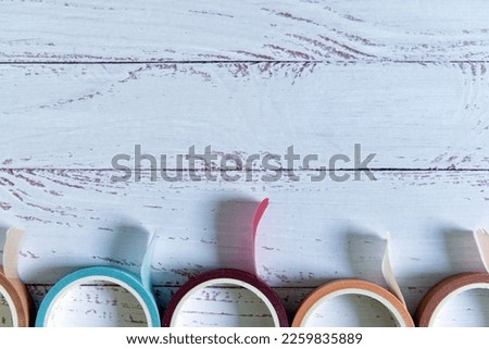 colorful washi tape on white wooden background - planning and journaling concept